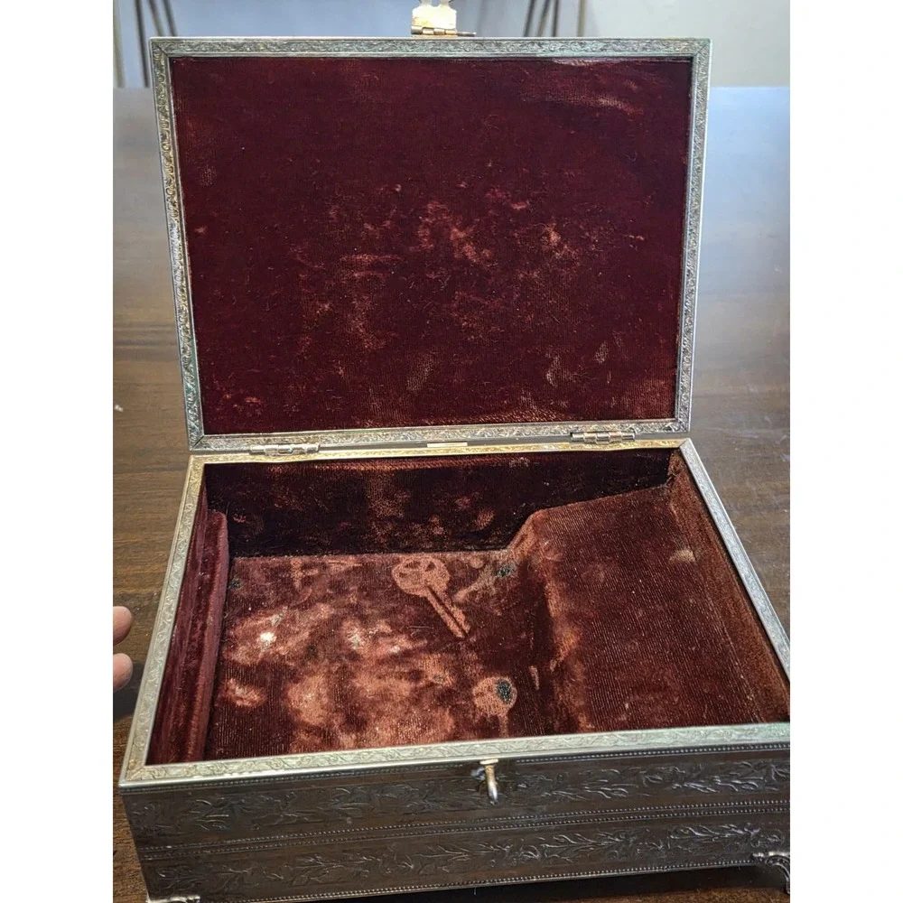 antique etched brass trinket box features a hinged lid Music Box